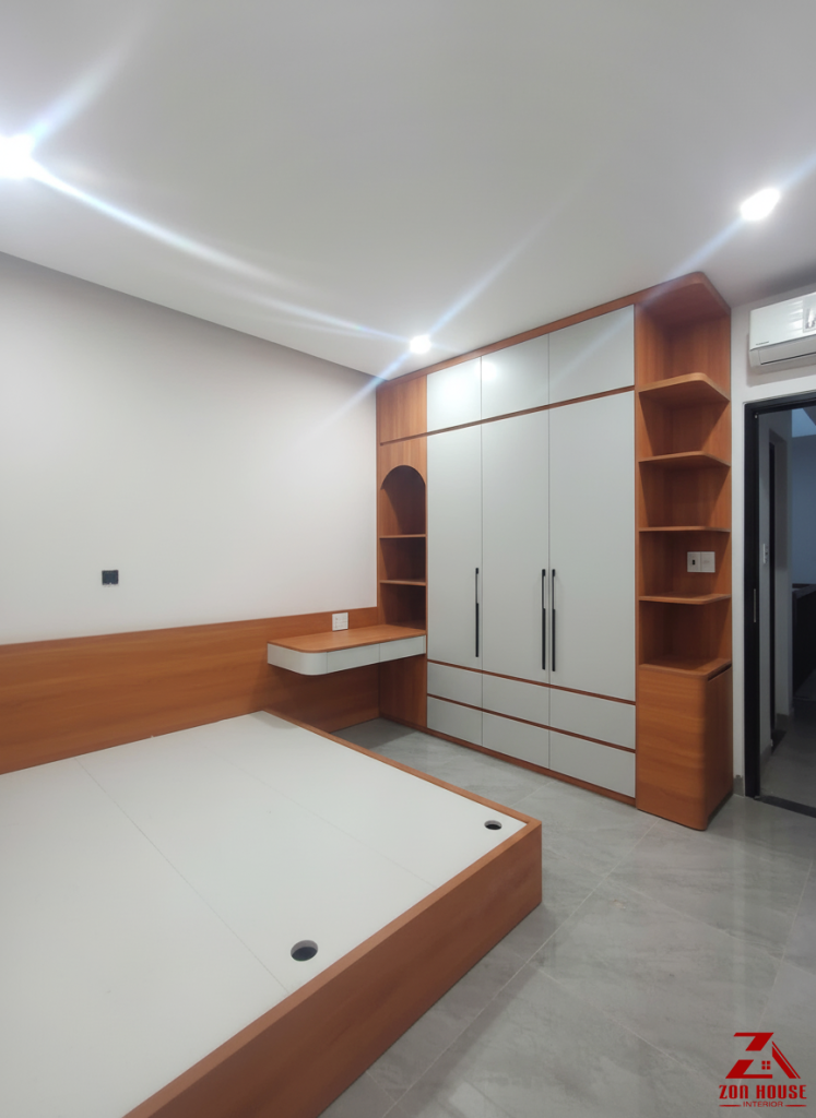 Phòng ngủ con gái thiết kế hiện đại, sử dụng hệ tủ áo liền kệ kết hợp bàn học