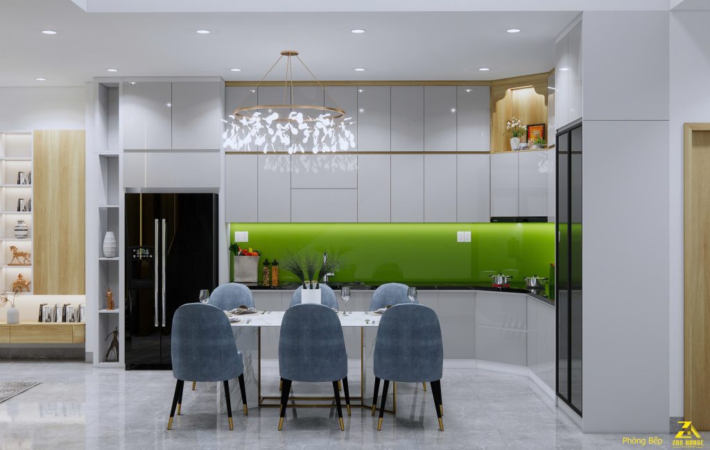Khu vực bếp nổi bật với mảng kính ốp tường màu xanh lá chuối làm điểm nhấn tươi mới, khác biệt cho không gian