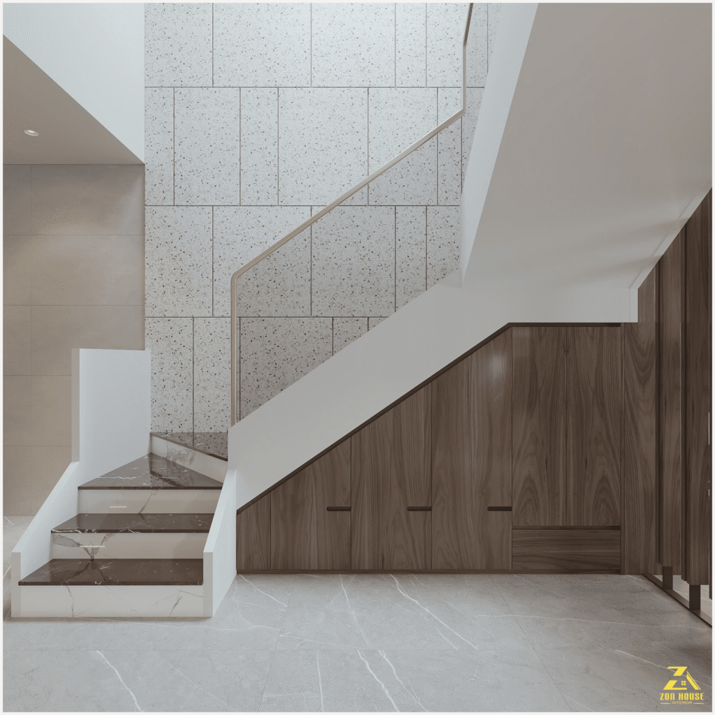 Phương án thiết kế nội thất nhà đẹp ưu tiên việc tích hợp hệ tủ gỗ âm tường dưới cầu thang để giải phóng diện tích sàn
